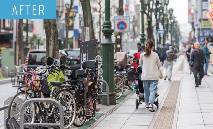 商店街の歩道上に駐輪場システムを導入し、快適な商店街に